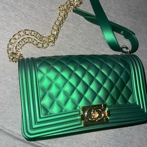 Metallic green purse.